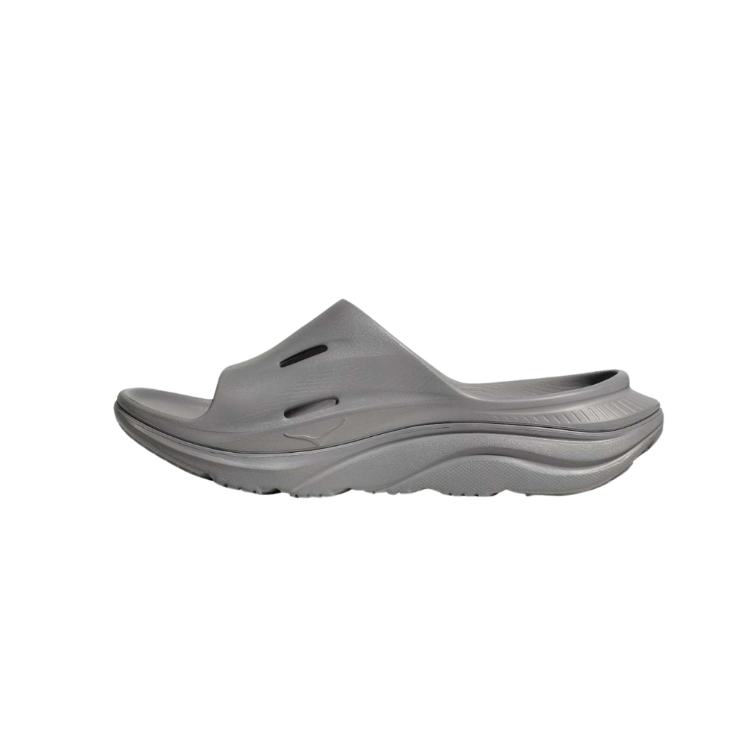 Side view of Unisex Ora Recovery Slide 3 in grey – featuring a soft, lightweight EVA foam upper for easy wear, contoured footbed designed to support foot arches and reduce plantar fasciitis pain, and cushioned midsole for shock absorption and all-day comfort.
