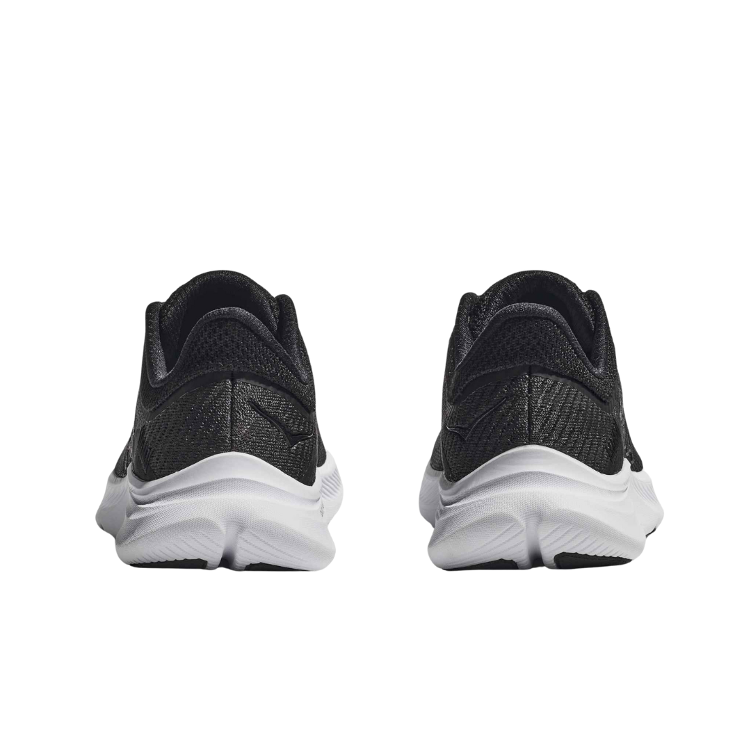 Back view of Women’s Solimar sandal in black and white – featuring adjustable ankle strap with hook-and-loop closure, low-profile heel for stability, and clean rear design for versatile styling.