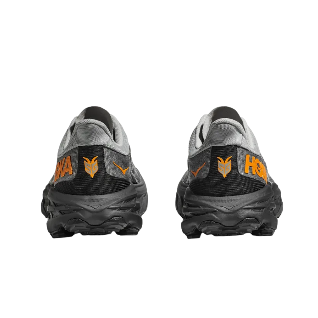 Back view of Men’s Speedgoat 5 trail running shoe in harbor mist and black – featuring molded heel counter for rearfoot stability, pull tab for easy on and off, and reflective accents for visibility in low-light conditions.