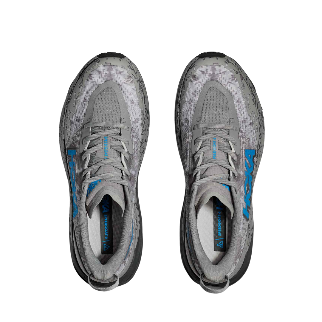 Top view of Men’s Hoka Speedgoat 6 trail running shoe in galactic grey and Hoka blue – featuring padded tongue and collar for ankle support, moisture-wicking lining to keep feet dry and healthy, and secure lace-up closure for locked-in fit.