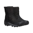 Side view of Women’s Betty Waterproof Pull-On Boot in black – featuring a waterproof leather and textile upper, KEEN.WARM insulation rated to -25°F for cold-weather warmth, and pull-on design with elastic side panels for easy on/off.