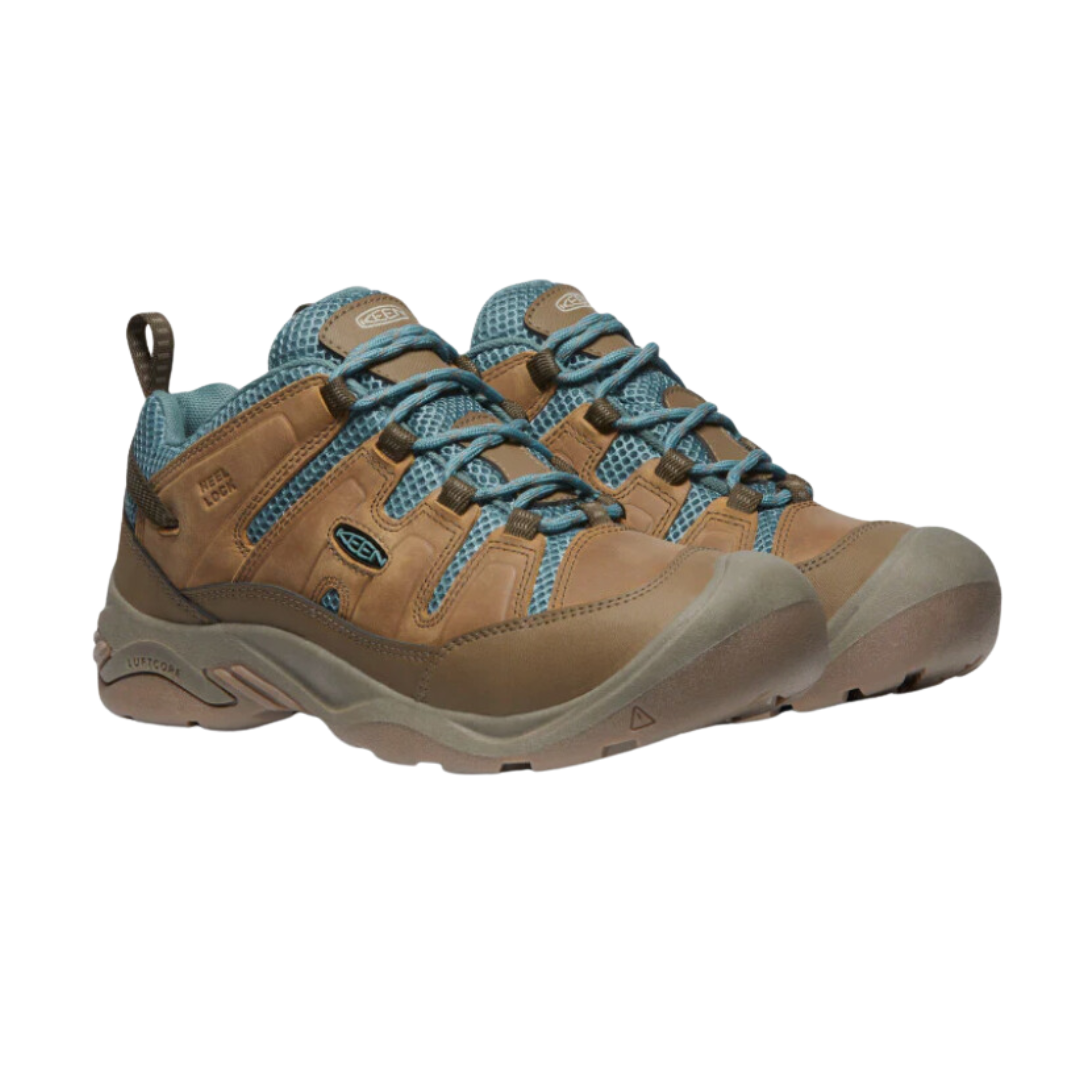 Side view of Women’s Circadia Vent hiking shoe in coconut and north atlantic – featuring a breathable mesh upper with synthetic overlays for lightweight support, cushioned midsole with advanced shock absorption to minimize joint stress, and reinforced toe cap for trail protection.