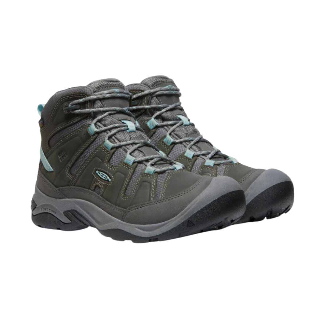 Side view of Women’s Circadia Mid Waterproof Boot in steel grey and cloud blue – featuring a waterproof nubuck leather and mesh upper for weather protection, cushioned midsole with advanced shock absorption to reduce joint strain, and reinforced toe and heel overlays for durability.