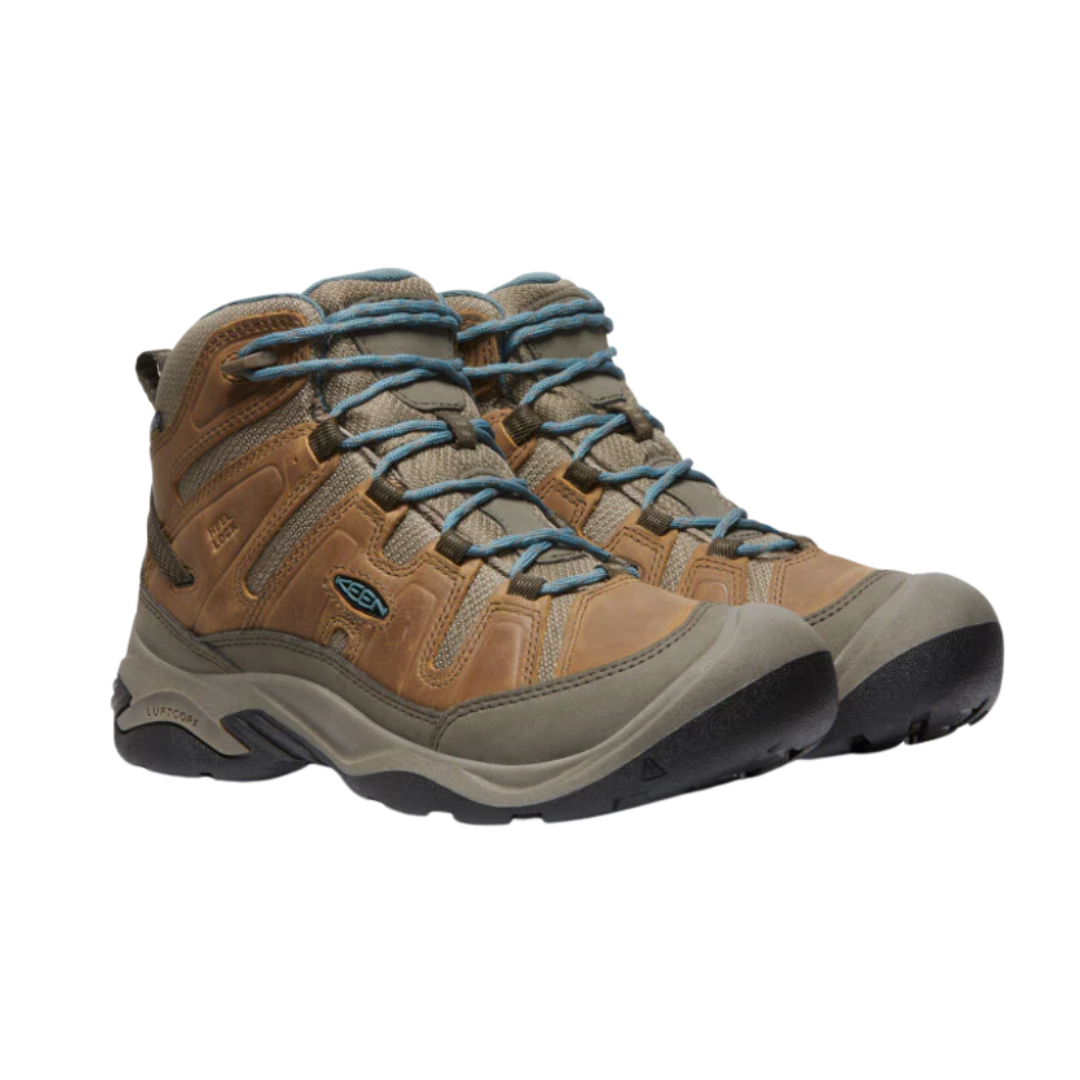 Side view of Women’s Circadia Mid Waterproof Boot in coconut and north atlantic – featuring a waterproof nubuck leather and mesh upper for weather protection, cushioned midsole with advanced shock absorption to reduce joint strain, and reinforced toe and heel overlays for durability.