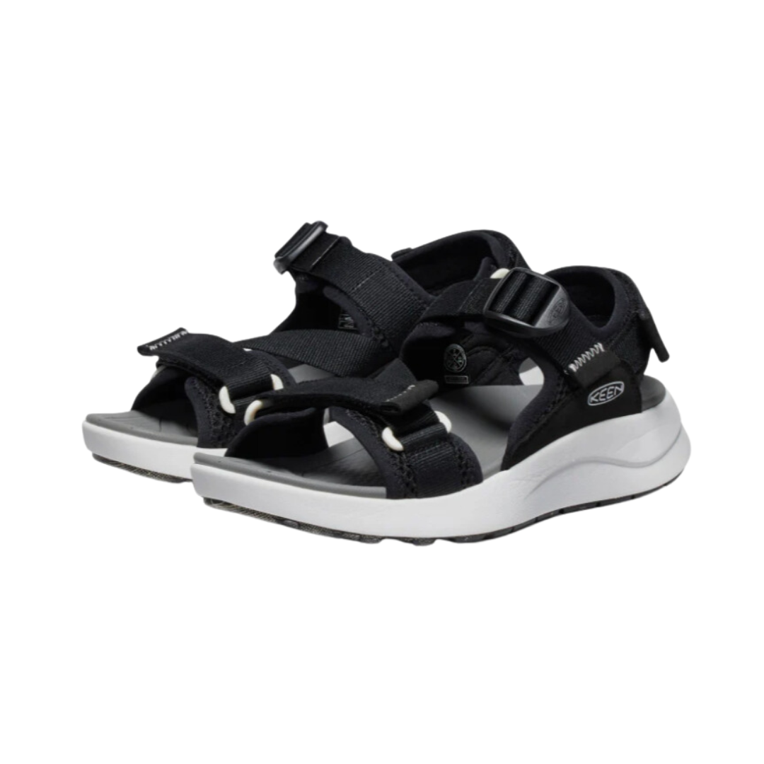 Side view of Women’s Elle Sport Backstrap sandal in black and steel grey – featuring a sporty elastic upper for flexible support, adjustable backstrap for a secure fit, and cushioned EVA midsole for lightweight all-day comfort.