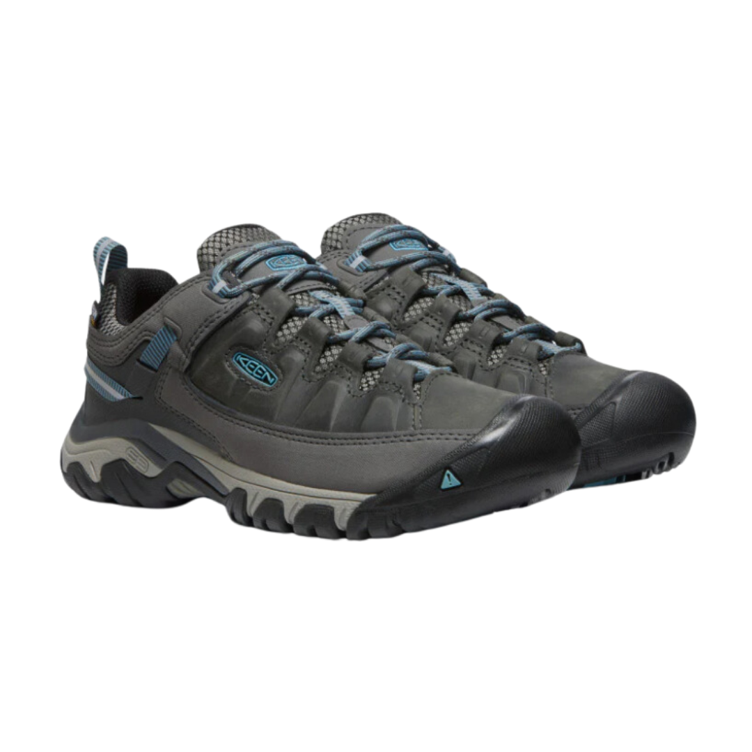 Side view of Women’s Targhee III Low hiking shoe in magnet and atlantic blue – featuring a durable nubuck leather and mesh upper for breathability, cushioned midsole for all-day comfort, and reinforced toe and heel overlays for protection.