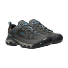 Side view of Women’s Targhee III Low hiking shoe in magnet and atlantic blue – featuring a durable nubuck leather and mesh upper for breathability, cushioned midsole for all-day comfort, and reinforced toe and heel overlays for protection.