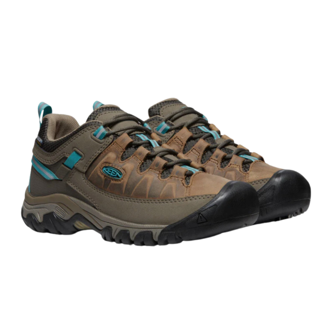 Side view of Women’s Targhee III Low hiking shoe in toasted coconut and porcelain – featuring a durable nubuck leather and mesh upper for breathability, cushioned midsole for all-day comfort, and reinforced toe and heel overlays for protection.