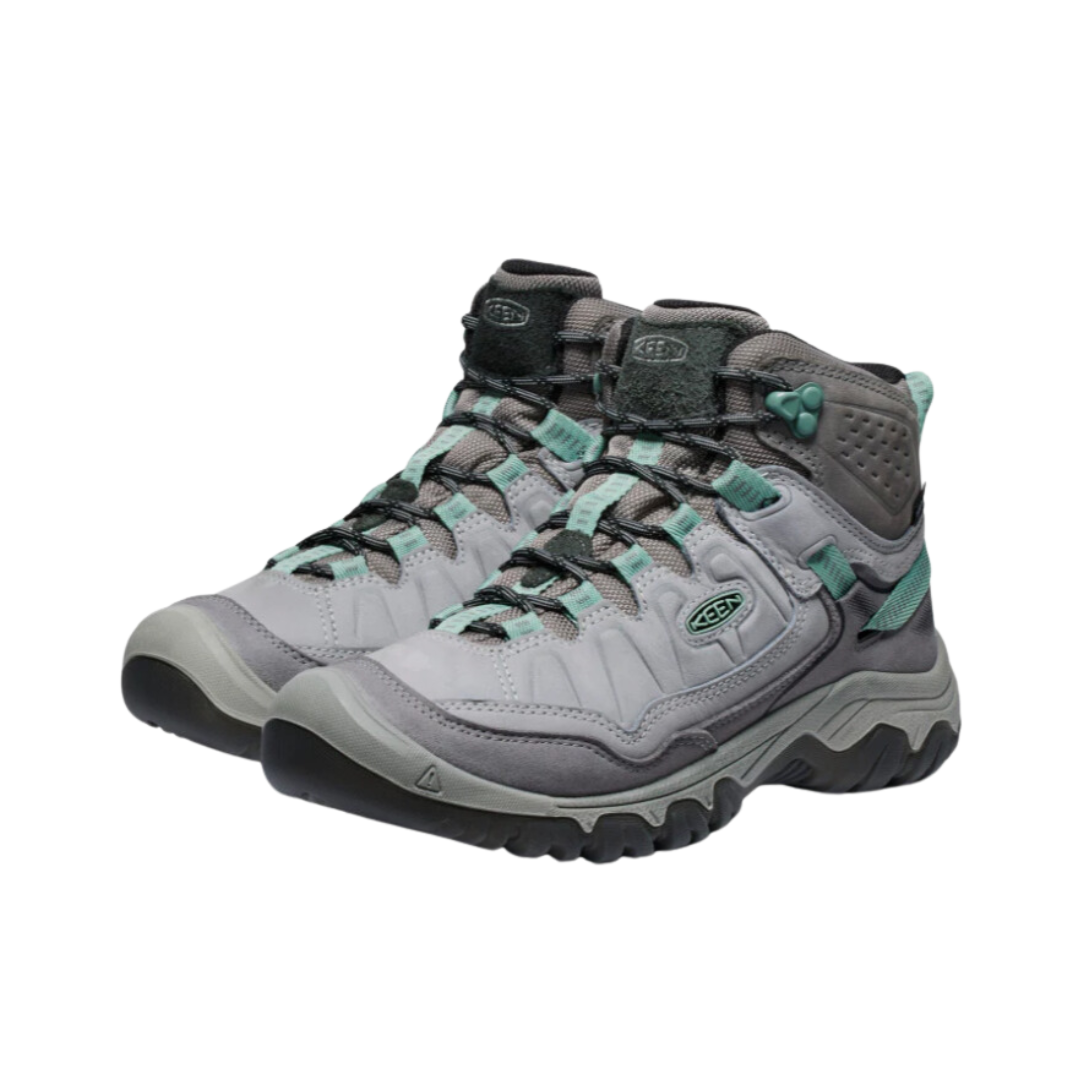Side view of Women’s Targhee IV Mid WP hiking boot in alloy and granite green – featuring a waterproof nubuck leather upper with breathable mesh panels, cushioned midsole for all-day comfort, and reinforced toe and heel overlays for durability.
