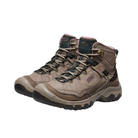 Side view of Women’s Targhee IV Mid WP hiking boot in brindle and nostalgia rose – featuring a waterproof nubuck leather upper with breathable mesh panels, cushioned midsole for all-day comfort, and reinforced toe and heel overlays for durability.