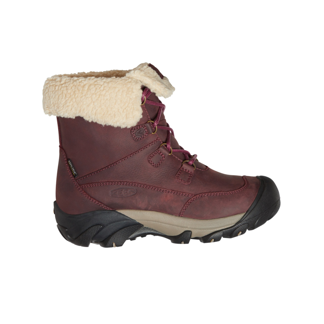 Side view of Women’s Betty Waterproof Short Boot in burgundy and brindle – featuring a waterproof leather and textile upper for protection in wet conditions, KEEN.WARM insulation rated to -25°F for cold weather, and a short boot height for versatile winter wear.