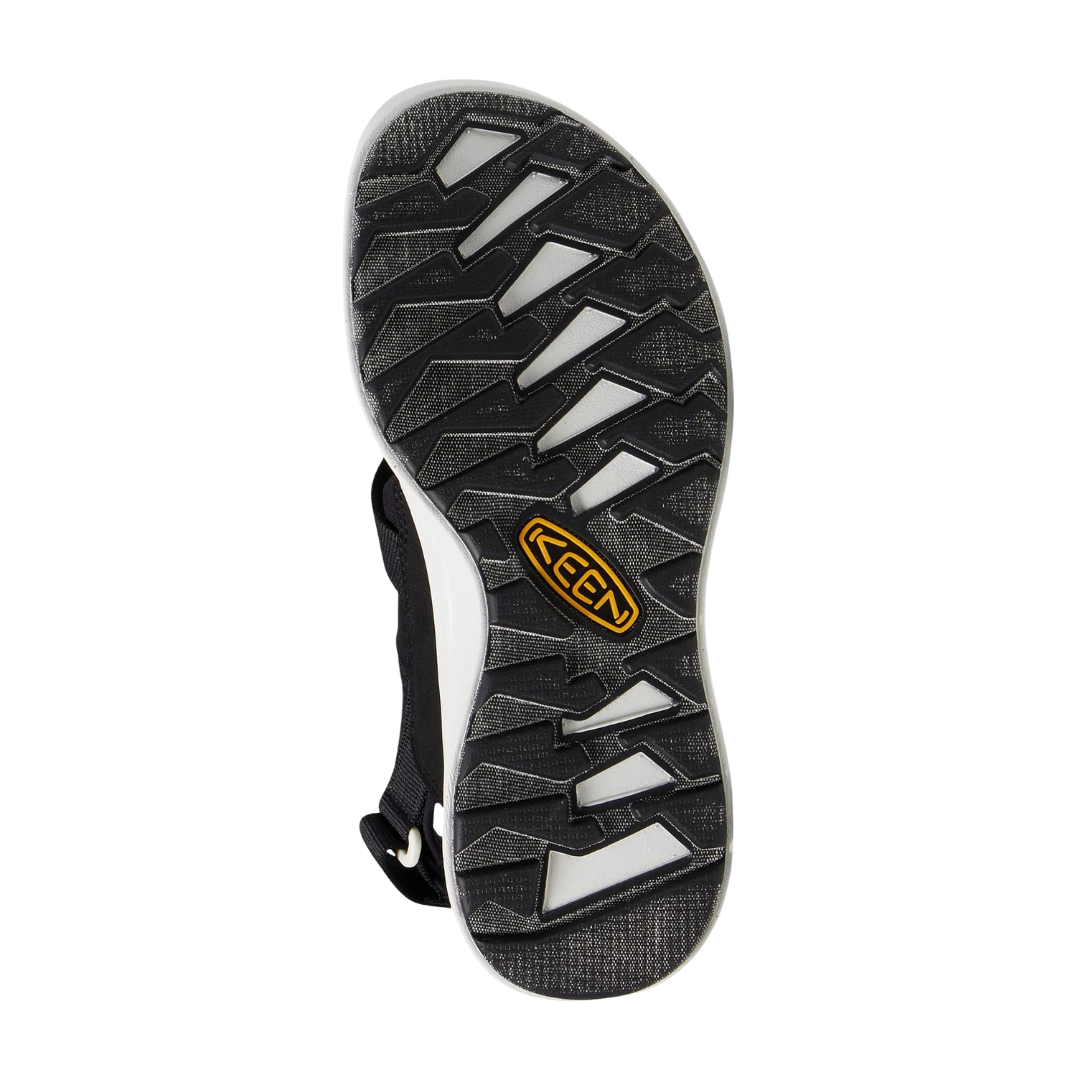 Bottom view of Women’s Elle Sport Backstrap sandal in black and steel grey – featuring a non-marking rubber outsole, low-profile tread for everyday traction, and flexible sole construction for natural foot movement.
