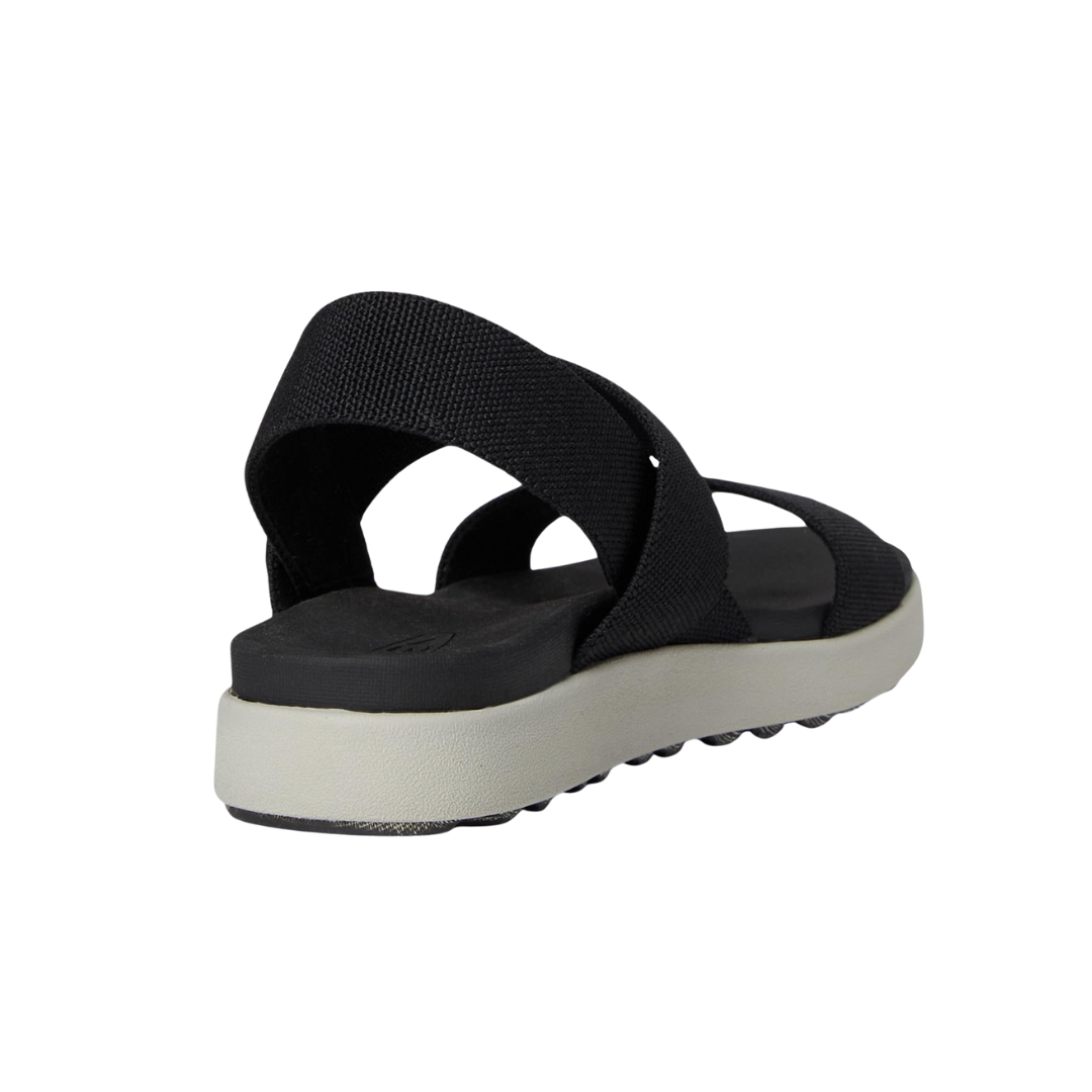 Back view of Women’s Elle Strappy sandal in black and vapor – featuring adjustable heel strap with buckle closure, low-profile heel for stability, and clean rear design for versatile pairing.