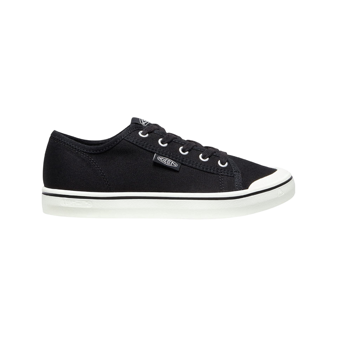 Side view of Women’s Elsa Lite sneaker in black and star white – featuring a lightweight canvas upper for breathable comfort, streamlined low-top design for everyday wear, and cushioned footbed for all-day support.