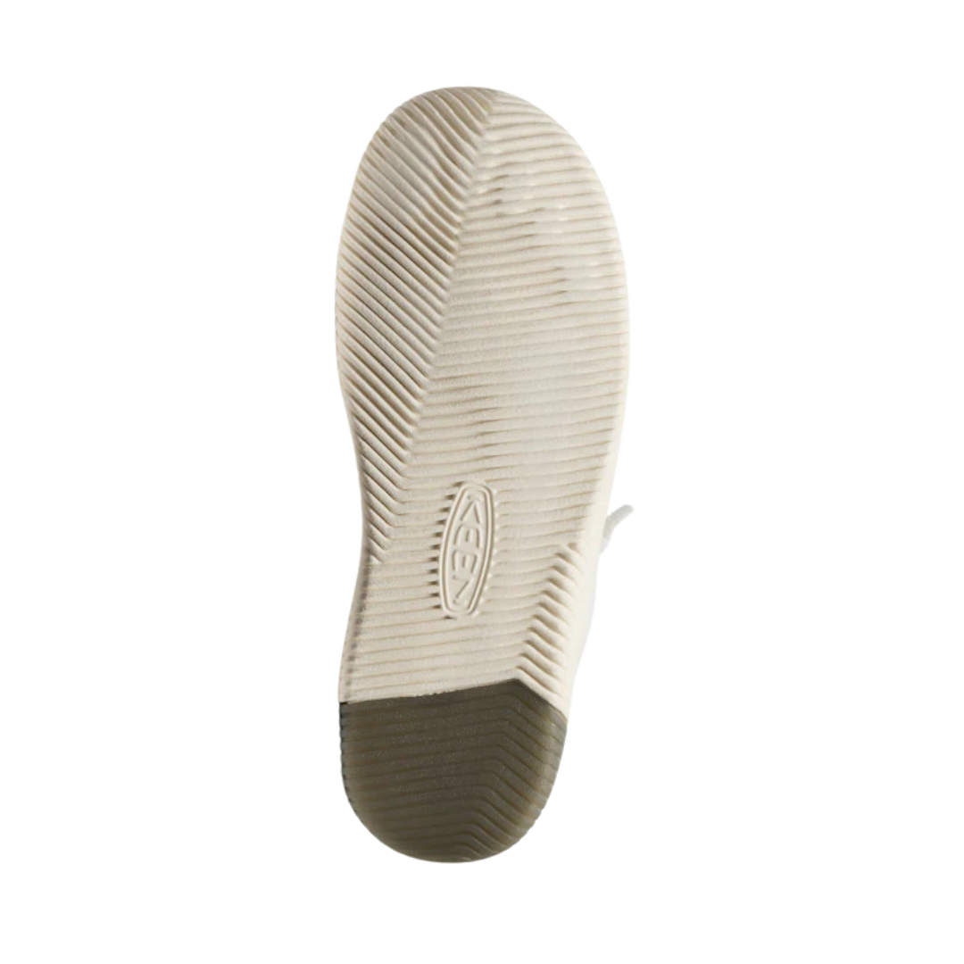 Bottom view of Men’s KNX Leather Sneaker in star white – featuring a non-marking rubber outsole, subtle tread pattern for traction on various surfaces, and flexible sole for natural foot movement.