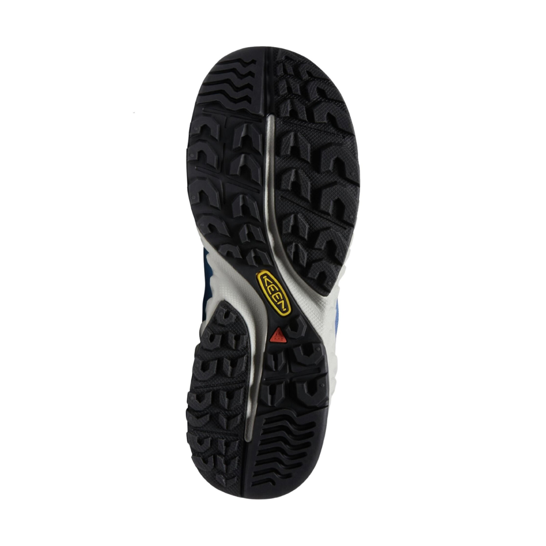 Bottom view of Women’s Nxis Speed Hiking Shoe in fjord blue and ombre – featuring a high-traction rubber outsole with multi-directional lugs for grip on varied terrain, flex grooves for natural foot motion, and a heel brake zone for controlled descents.