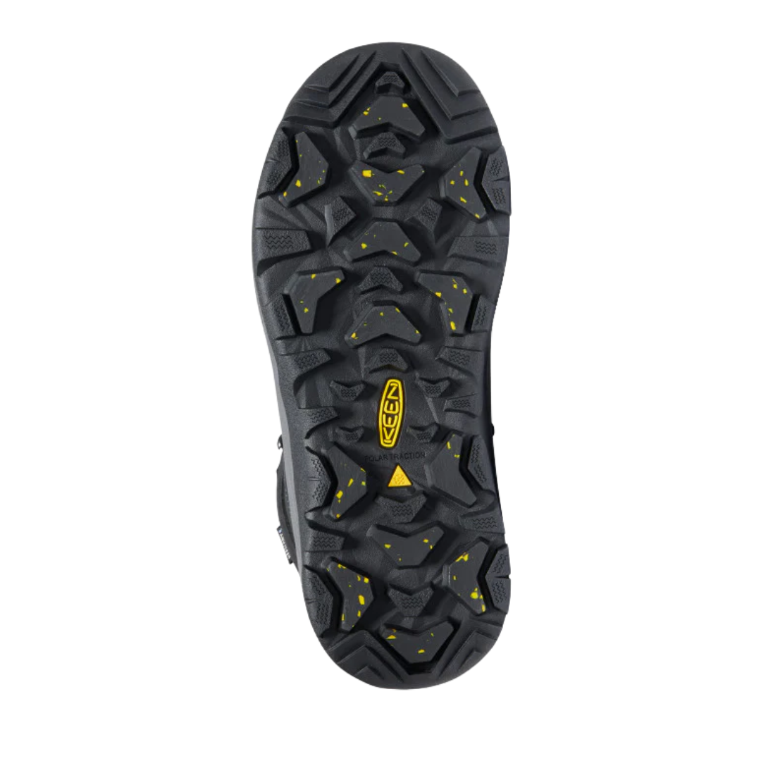 Bottom view of Women’s Revel IV High Polar Boot in black and north atlantic – featuring a KEEN.FREEZE rubber outsole with micro-glass fiber lugs for superior icy traction, flex grooves for natural foot movement, and slip-resistant tread to prevent falls.