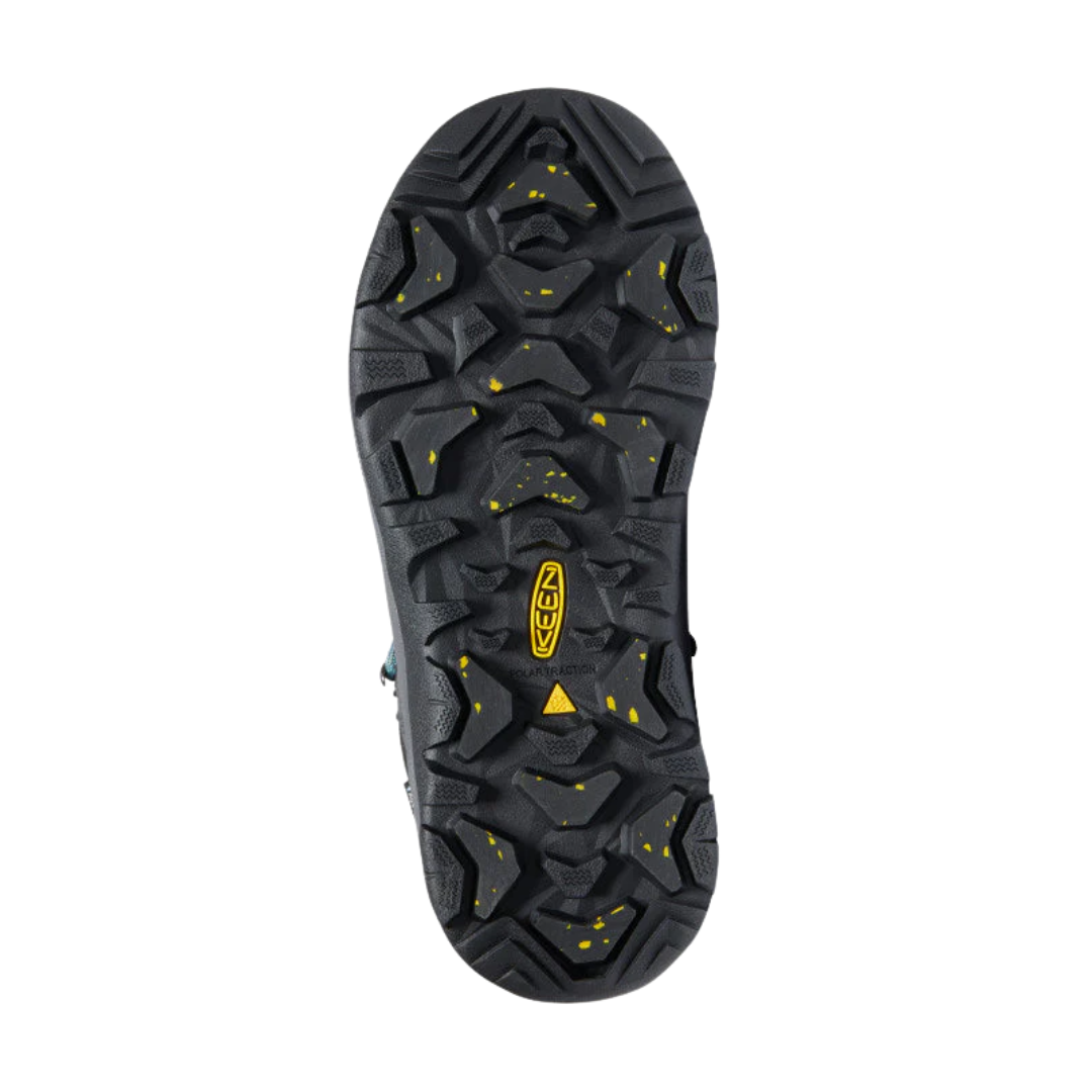 Bottom view of Women’s Revel IV Polar Boot in magnet and north atlantic – featuring a KEEN.FREEZE rubber outsole with micro-glass fiber lugs for superior icy traction, flex grooves for natural foot movement, and slip-resistant tread to reduce fall risk.