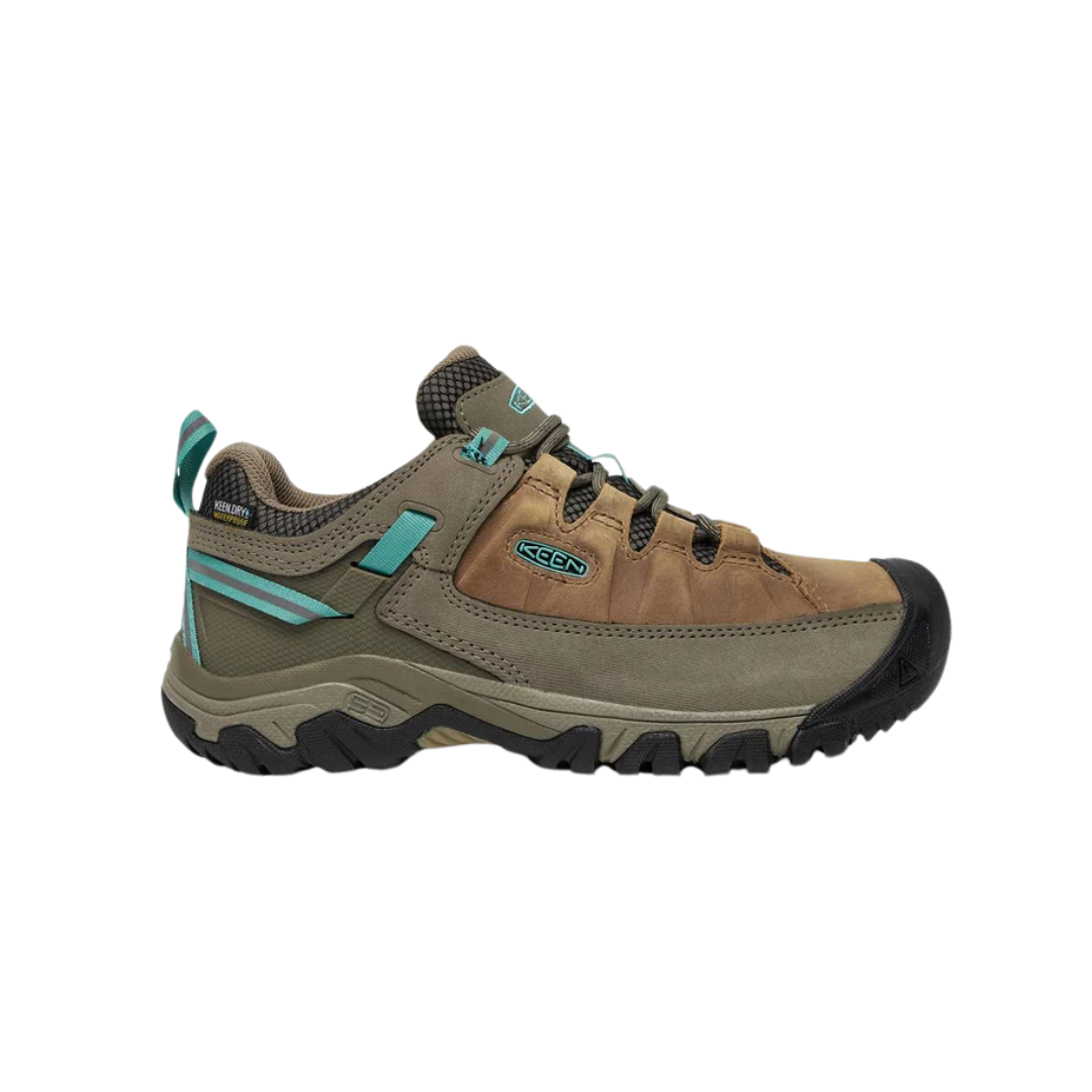 Side view of Women’s Targhee III Low hiking shoe in toasted coconut and porcelain – featuring a durable nubuck leather and mesh upper for breathability, cushioned midsole for all-day comfort, and reinforced toe and heel overlays for protection.