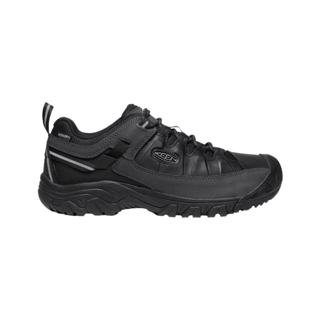 Side view of Men’s Targhee III Waterproof hiking boot in triple black – featuring a waterproof nubuck leather upper, breathable mesh panels for ventilation, and cushioned midsole for all-day hiking comfort.