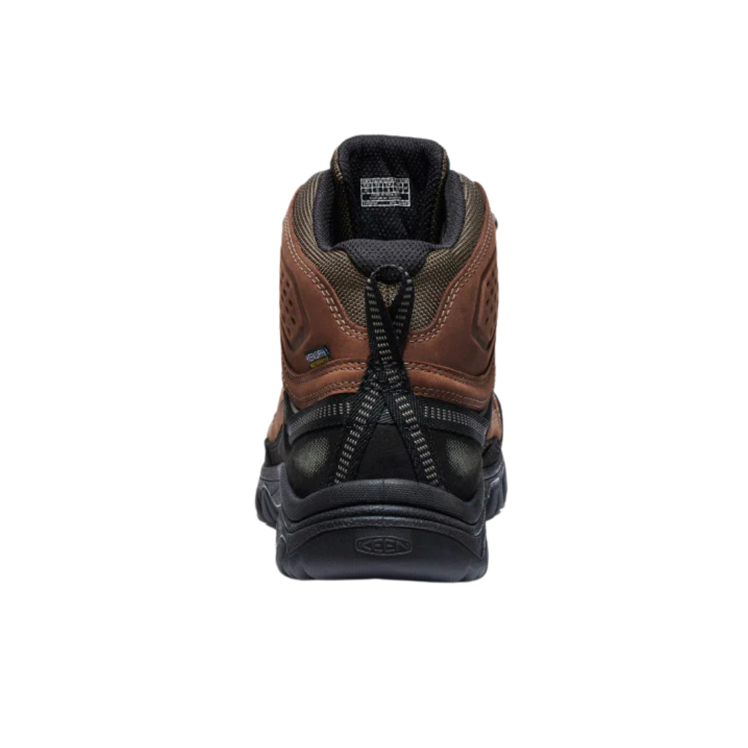 Back view of Men’s Targhee IV Mid Waterproof Boot in bison and black – featuring a molded heel counter for rearfoot stability, pull tab for easy on and off, and reflective accents for enhanced low-light visibility.