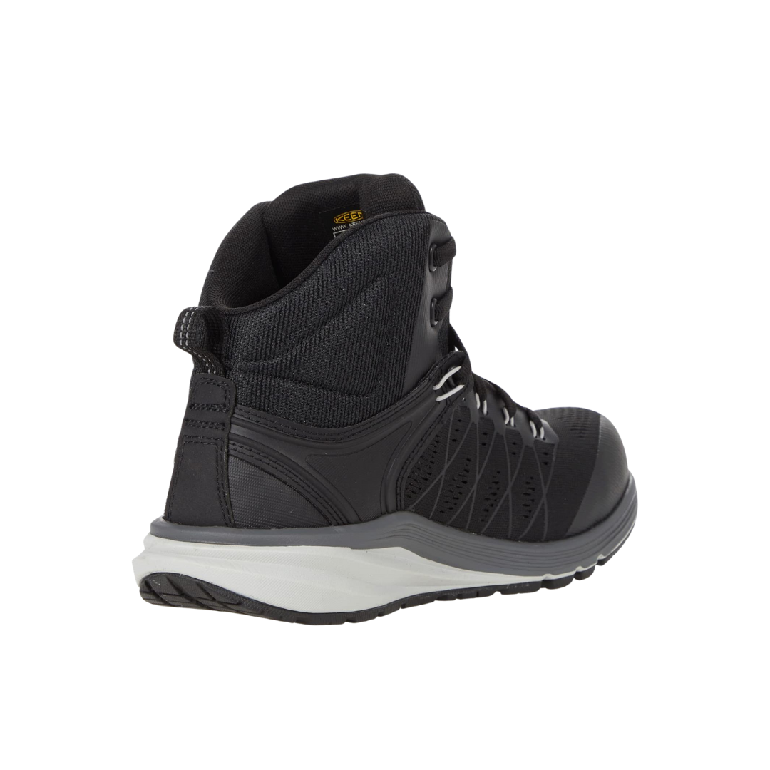 Back view of Women’s Vista Energy Mid (Carbon Toe) boot in vapor and black – featuring a molded heel counter for stability, heel loop for easy on and off, and sleek design lines for a modern work-ready look.