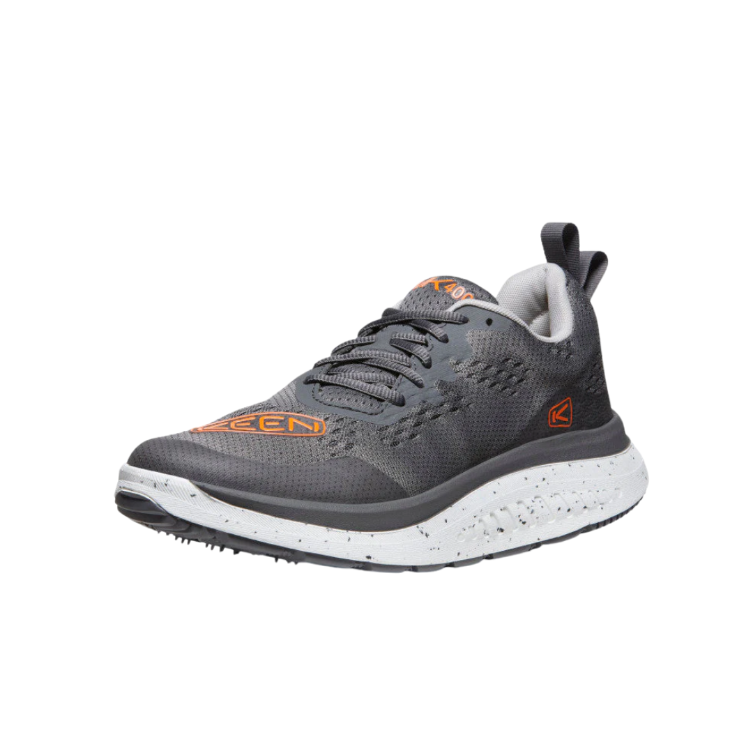 Angled view of Men’s WK400 walking shoe in steel grey and scarlet ibis – featuring a streamlined athletic silhouette, heel-to-toe curve for forward propulsion, and bold contrast accents for a modern look.