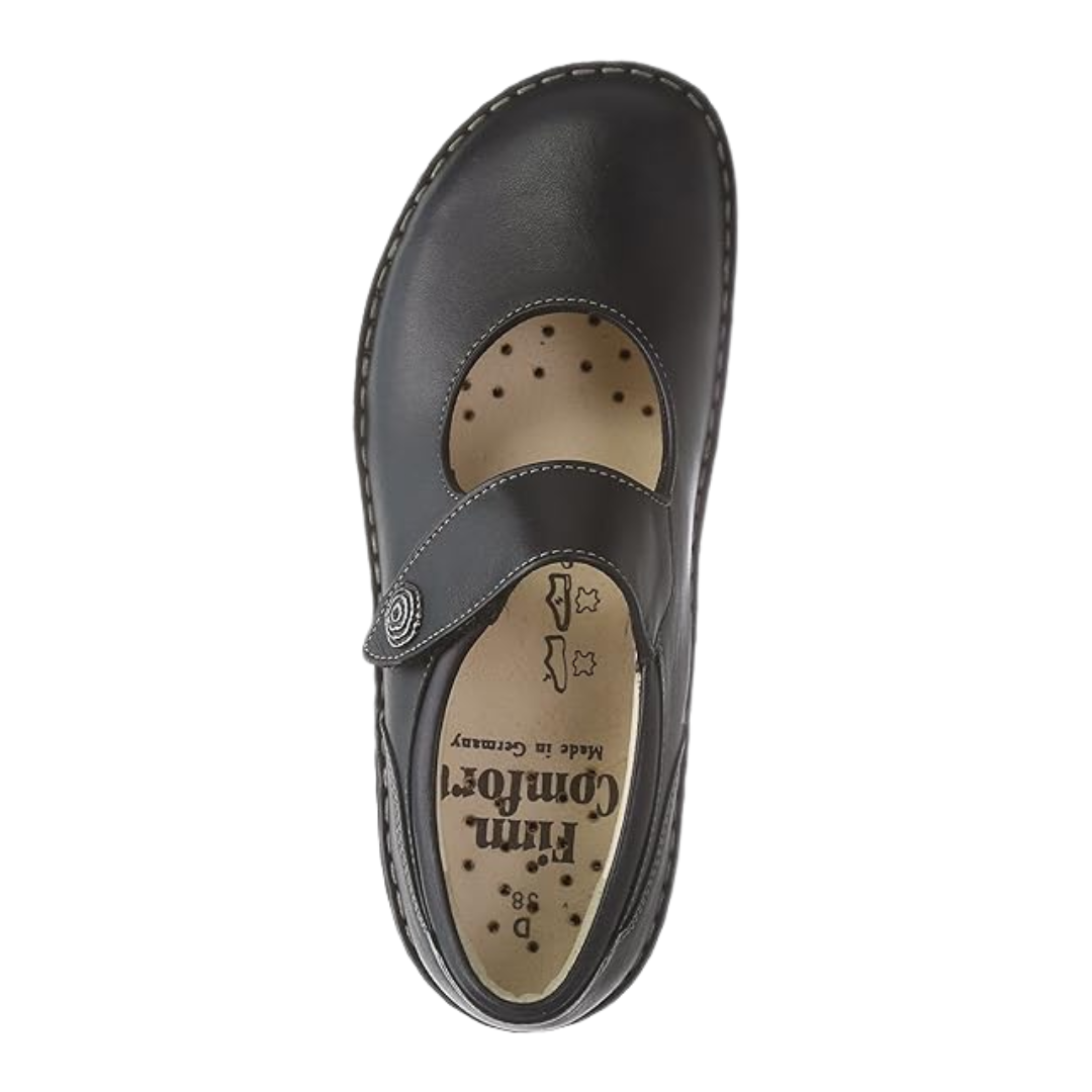Top View of Women’s Finn Comfort Laval Mary Jane shoe in Black Nappaseda leather – featuring a single adjustable hook-and-loop strap with a decorative metal medallion, a contoured removable cork footbed, and a roomy toe box for all-day comfort.