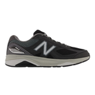 Side view of Men’s New Balance 1540v3 athletic shoe in black, grey, and white – featuring premium leather and mesh upper, cushioned midsole, and supportive outsole.