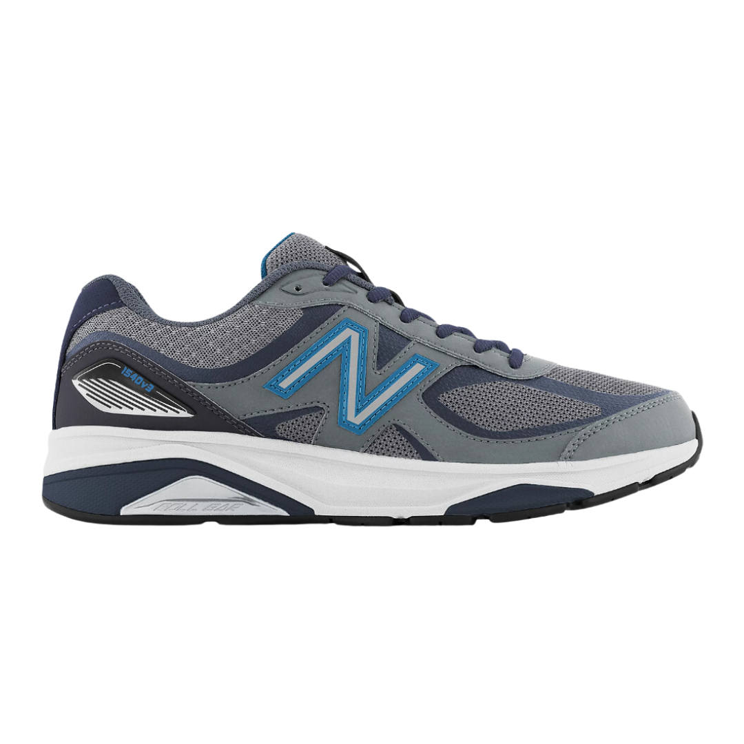 Side view of Men’s New Balance 1540v3 athletic shoe in navy, light blue, and white – featuring leather and mesh upper, cushioned midsole, and durable outsole.