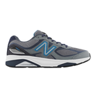 Side view of Men’s New Balance 1540v3 athletic shoe in navy, light blue, and white – featuring leather and mesh upper, cushioned midsole, and durable outsole.