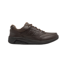 Side view of Men’s New Balance 928v3 athletic shoe in all brown – featuring premium leather upper, cushioned midsole for stability, hook and loop straps for adjustable fit, and durable outsole.
