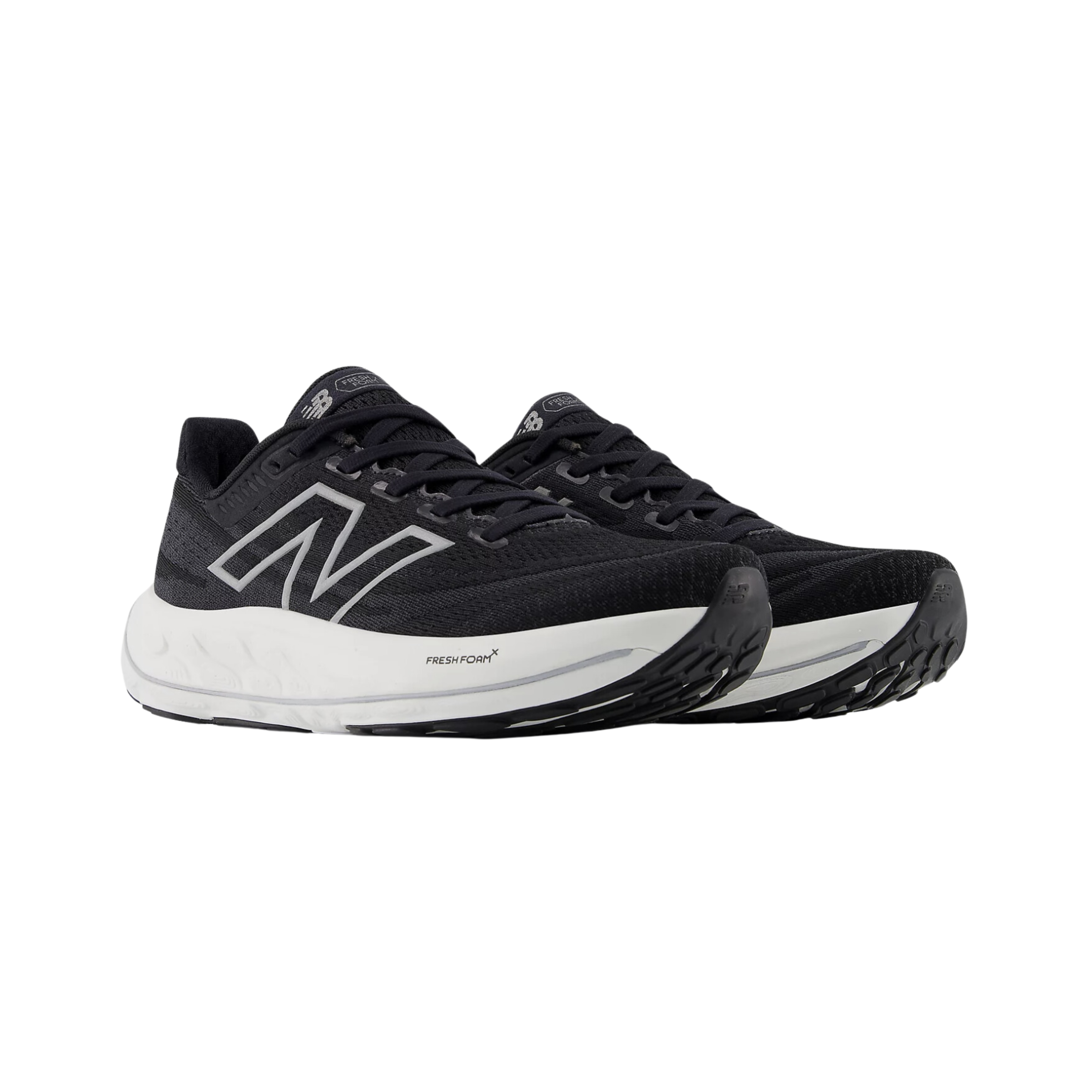 Side view of Women’s New Balance Fresh Foam x Vongo v6 trail running shoe in black and white – featuring Fresh Foam cushioning, supportive upper, rugged outsole, and stability design.