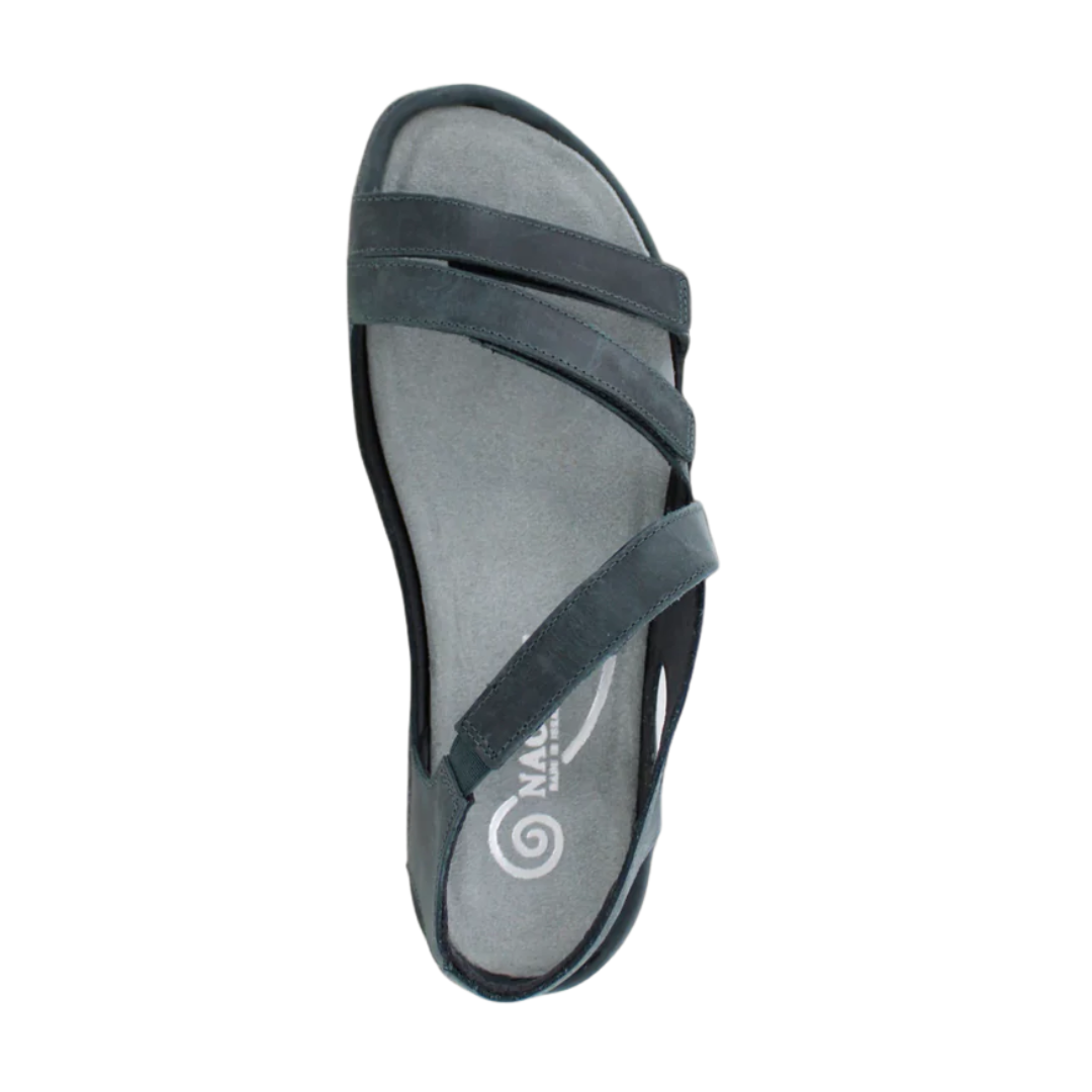 Top view of Women’s Whetu in Oily Shadow Nubuck – displaying the crisscrossing nubuck straps in a deep grey hue, cushioned footbed, and open-air design for a stylish and supportive everyday sandal.