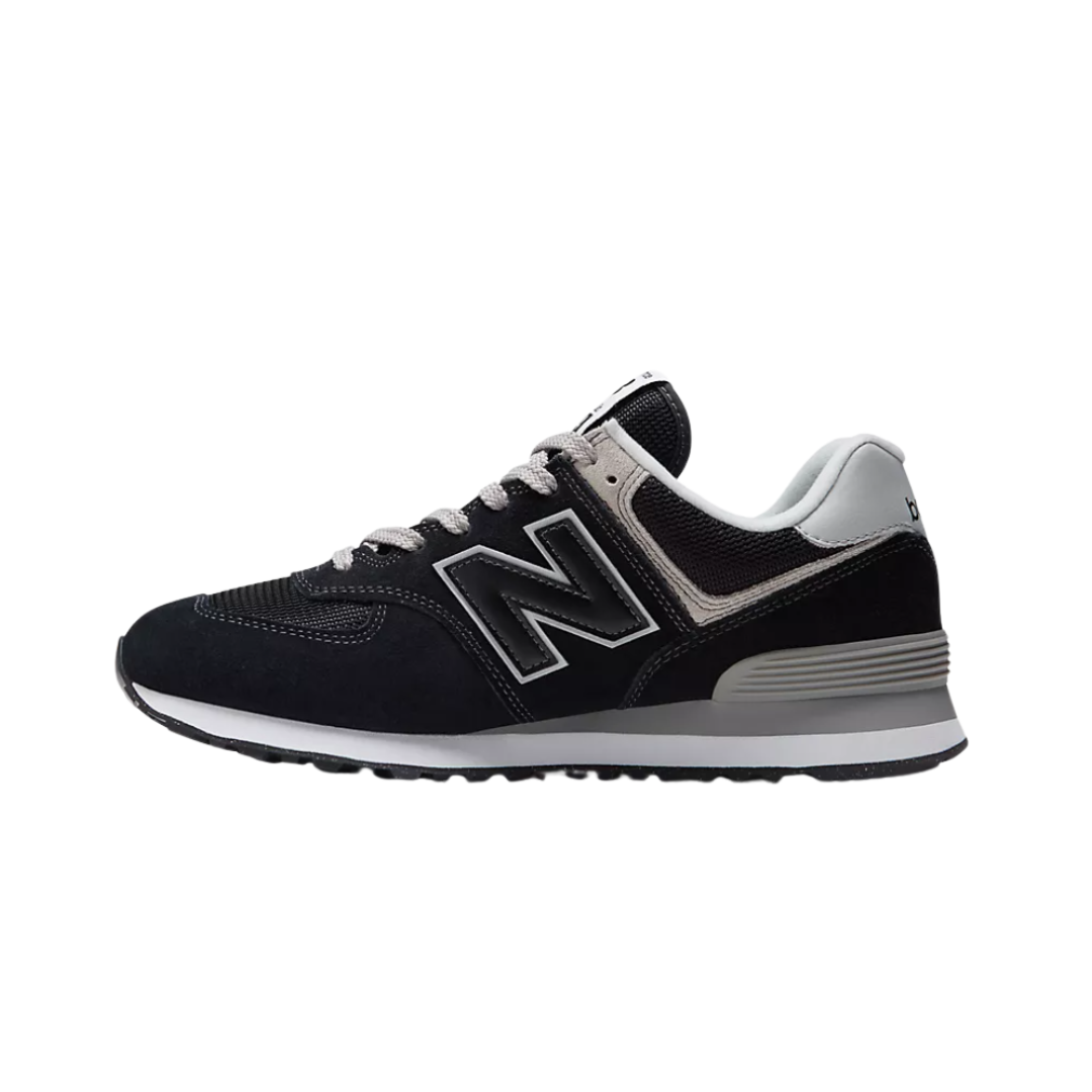 Side view of Men’s New Balance 574 casual sneaker in black/white/grey – featuring suede and mesh overlays, cushioned forefoot, ENCAP midsole for stability and support.