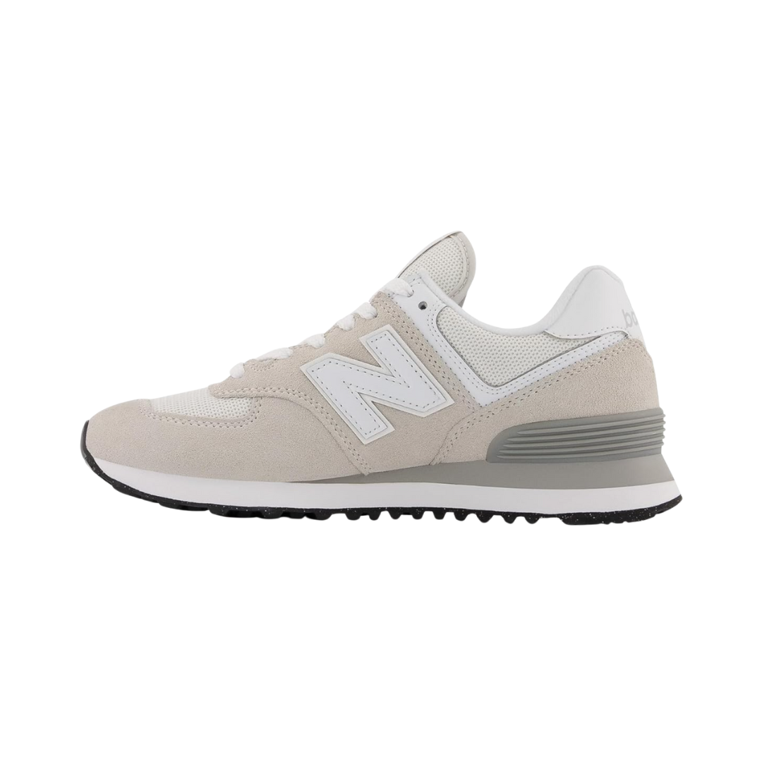 Side View of Women’s New Balance 574 Core sneaker in Nimbus Cloud with white – featuring durable rubber outsole, ENCAP midsole technology, and patterned tread for traction.