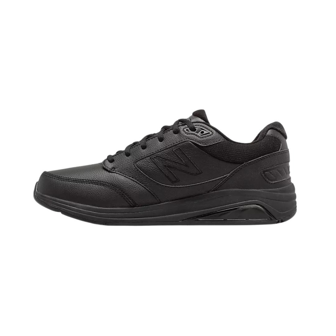 Side View of Men’s New Balance 928v3 walking shoe in black – featuring full-grain leather upper, ROLLBAR motion control technology, and ABZORB cushioning for all-day support.
