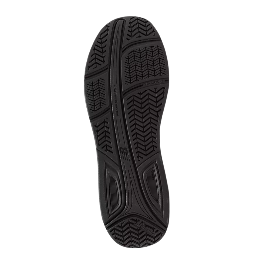 Bottom view of Men’s New Balance 928v3 walking shoe in black – featuring a durable rubber outsole, slip-resistant tread, and enhanced arch support for stability.