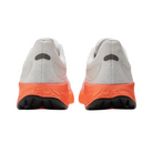 Back View of Men’s New Balance Fresh Foam X 1080v12 running shoe in white with orange – featuring structured heel counter, pull tab for easy on and off, and subtle branding.
