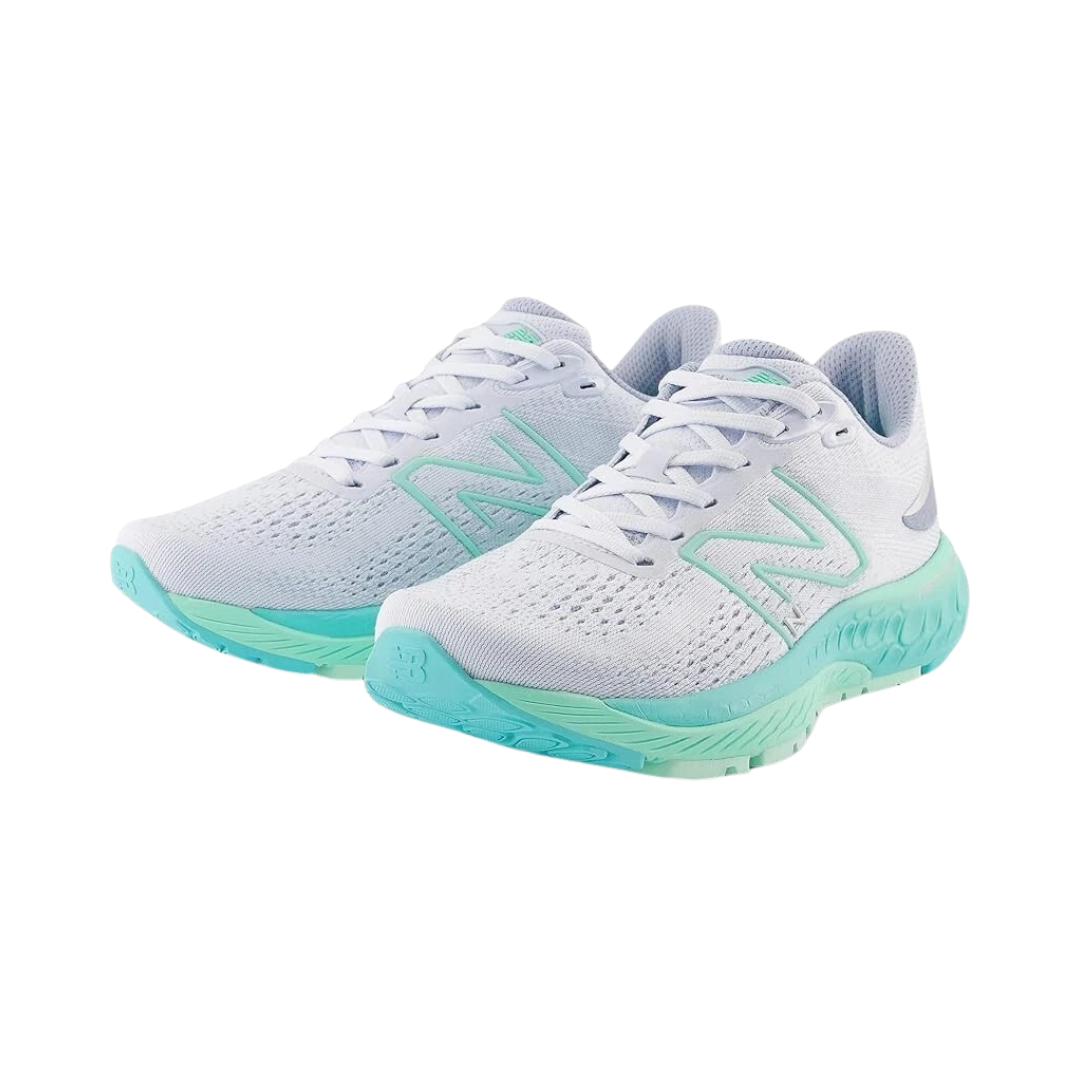 Angled view of Women’s New Balance Fresh Foam X 880v12 in Starlight/Bright Mint/Cyber Jade – featuring lightweight construction, supportive cushioning, and durable outsole suitable for running activities.