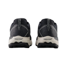 Back View of Men’s New Balance Fresh Foam X Hierro v7 trail running shoe in black reflection with white – featuring structured heel counter, pull tab for easy on and off, and reflective accents for enhanced visibility.