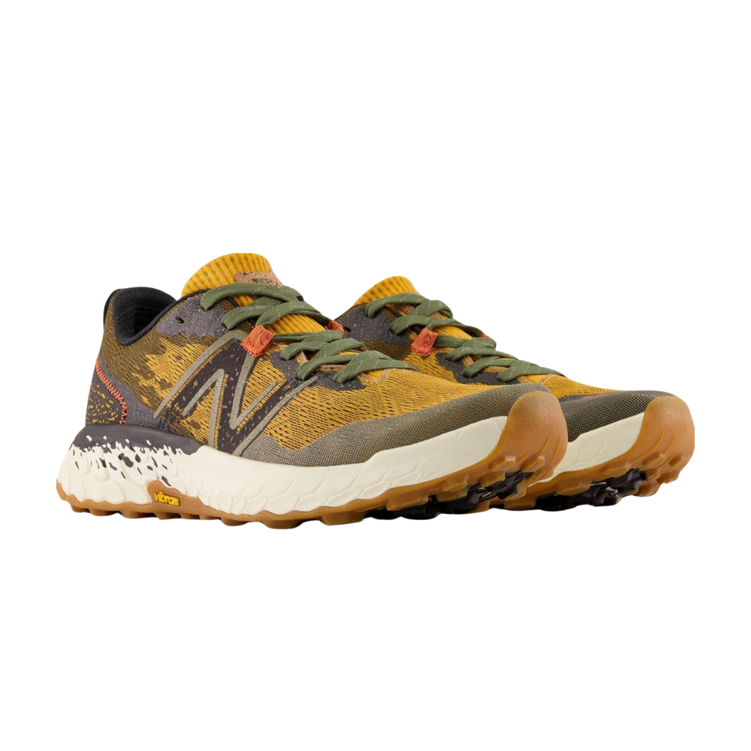 Side View of Men’s New Balance Fresh Foam X Hierro v7 trail running shoe in golden hour with dark camo and black – featuring engineered mesh upper with camo print, Fresh Foam X midsole cushioning for plush comfort, and Vibram® outsole for superior traction on rugged trails.
