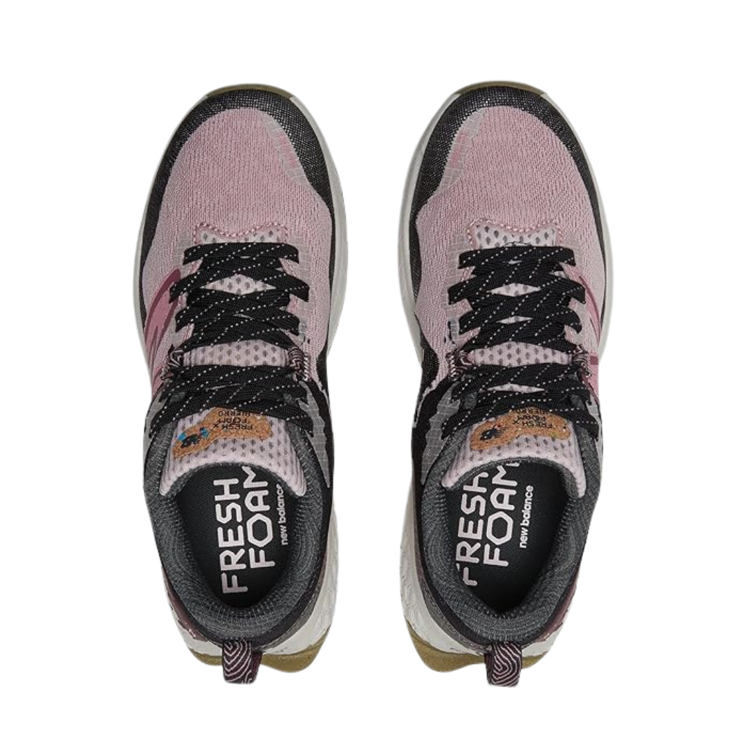 Top view of Women’s New Balance Fresh Foam X Hierro v7 in Stone Pink/Blacktop/Washed Burgundy – featuring a breathable engineered mesh upper, lace-up closure, and reinforced toe cap for added protection.