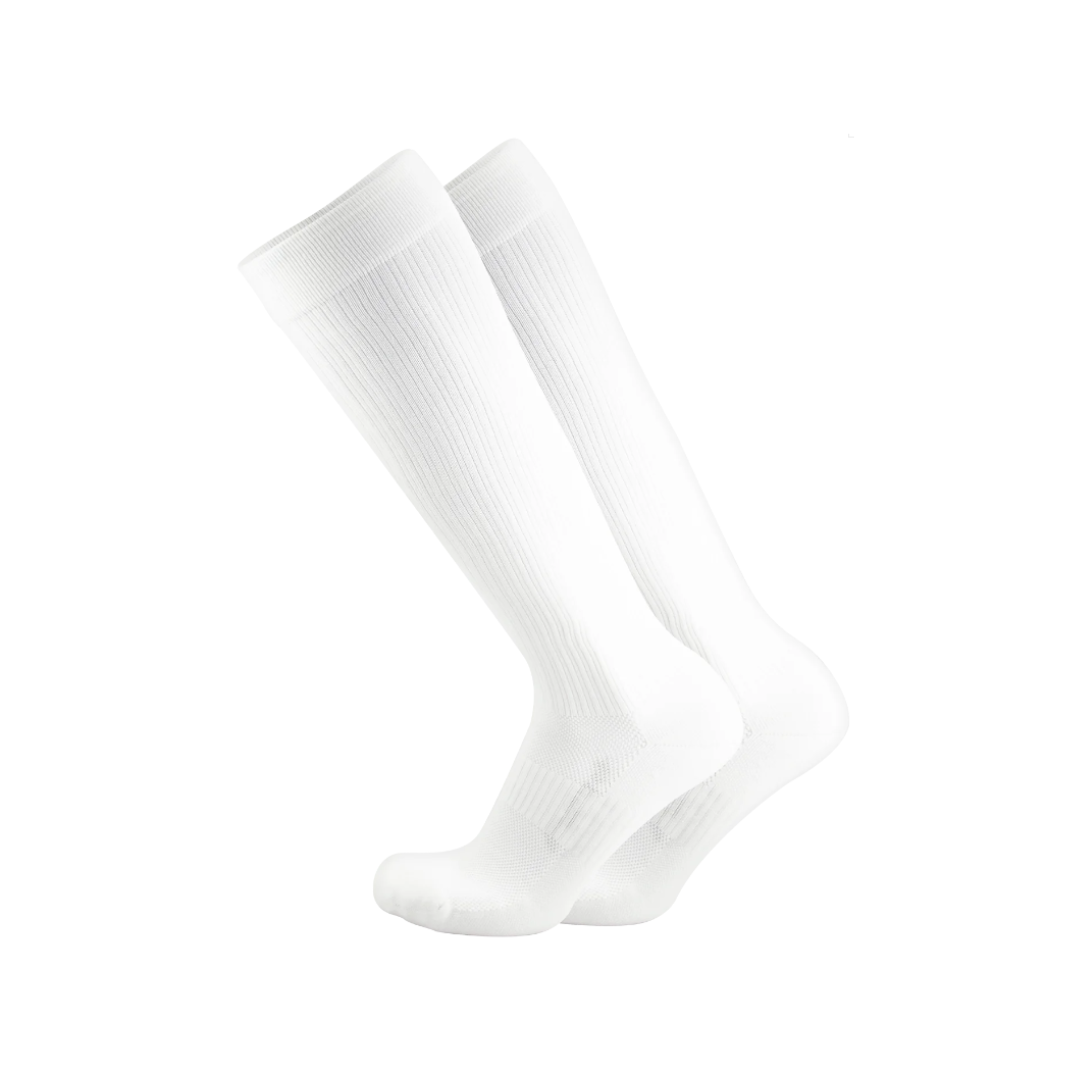 Side view of Unisex OS1st Travel knee socks in all white – featuring graduated compression to reduce swelling, moisture control fabric, reinforced heel and toe, and knee-high length for enhanced circulation.