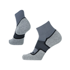 Side view of Unisex OS1st Wellness Performance quarter crew socks in grey and black – featuring graduated compression, padded footbed, breathable fabric, and reinforced durability.