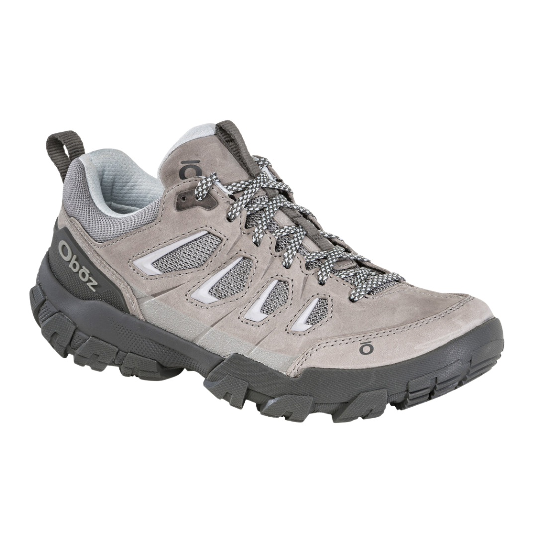 Angled view of Women's Oboz Sawtooth X Low hiking shoe in Drizzle – featuring waterproof nubuck leather and abrasion-resistant textile upper, cushioned midsole, and durable outsole engineered for reliable trail performance.