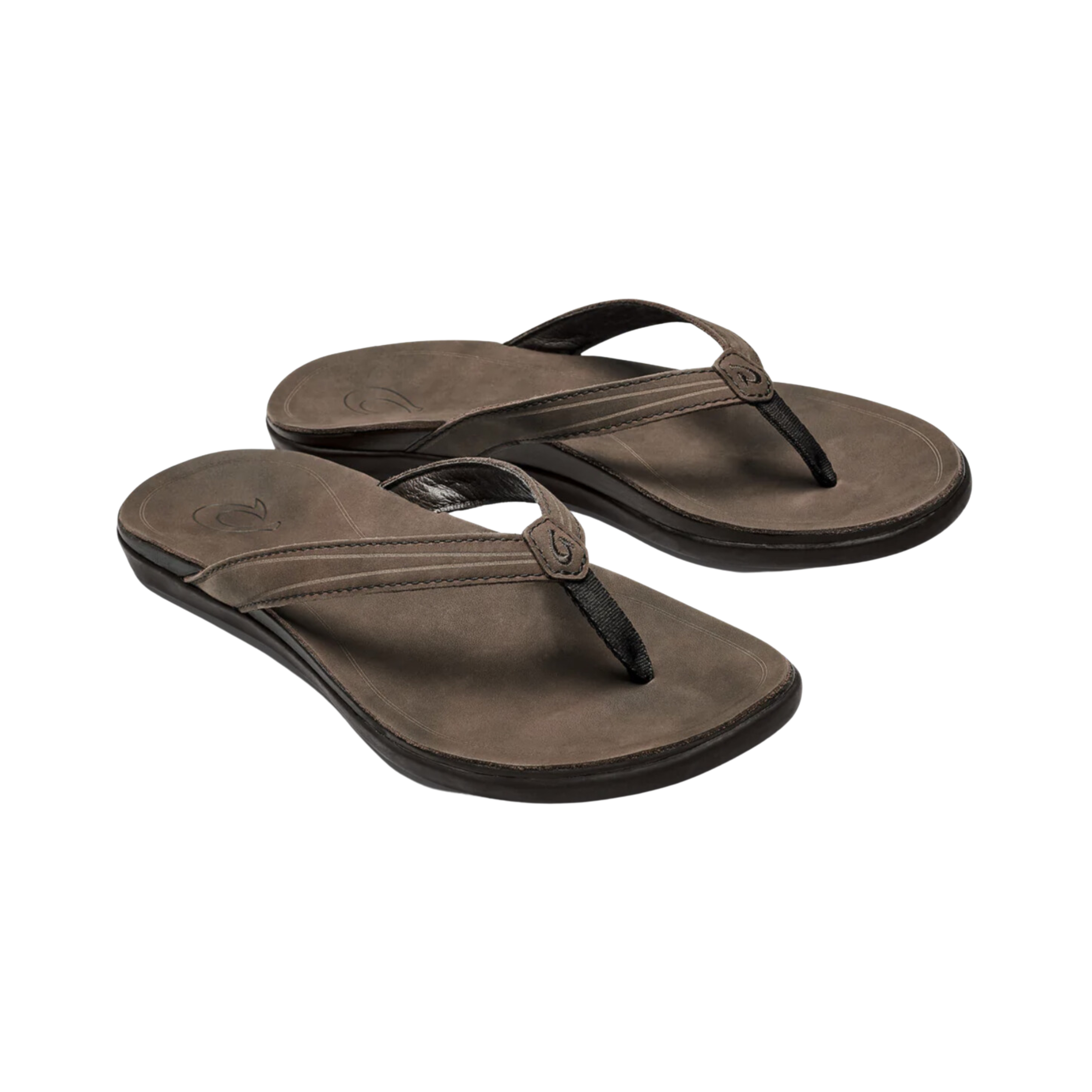 Angled view of Women’s Olukai ʻAukai sandal in Dark Java/Dark Java – featuring a premium leather upper, microfiber-lined straps, anatomically contoured footbed, and a refined silhouette for elevated everyday wear.