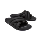 Angled view of Women’s Olukai Hila sandal in black – features include a water-friendly synthetic strap, plush cushioned footbed with arch support, slim and stylish profile, and a textured outsole for added stability.