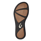 Bottom view of Women’s Olukai ʻAukai sandal in Dark Java/Dark Java – featuring a non-marking rubber outsole with textured tread for traction, embossed floral pattern, and slim profile for a clean, lightweight feel.