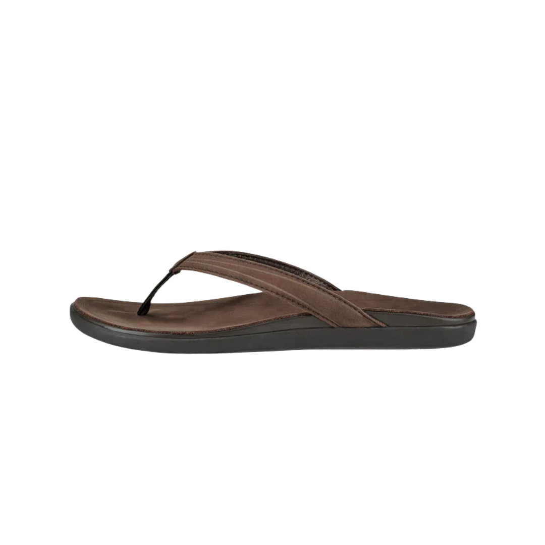 Side view of Women’s Olukai ʻAukai sandal in Dark Java/Dark Java – featuring a sleek, full-grain leather upper, soft microfiber lining, contoured anatomical footbed, and non-marking rubber outsole for refined, everyday comfort.